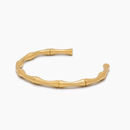Gold bamboo cuff bracelet worn on wrist — Olivia Jewelry