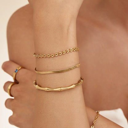 Bamboo gold cuff bracelet lifestyle shot — Olivia Jewelry