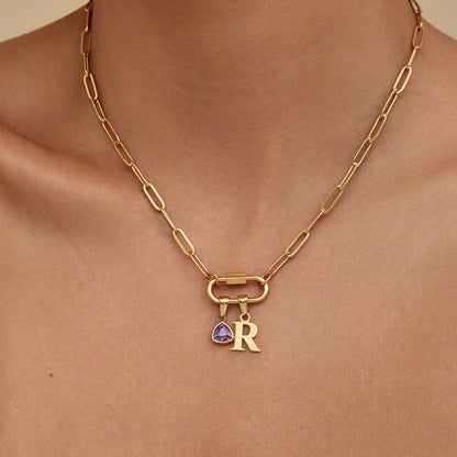 Carabiner initial birthstone necklace flat lay — Olivia Jewelry