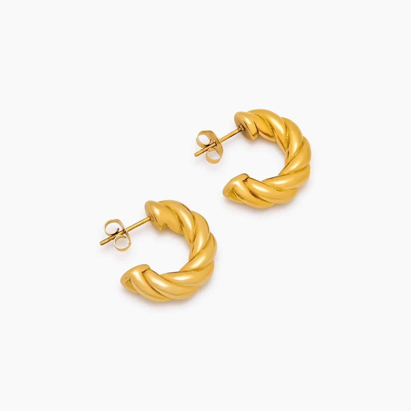 Demi twist earrings flat lay — Olivia Jewelry