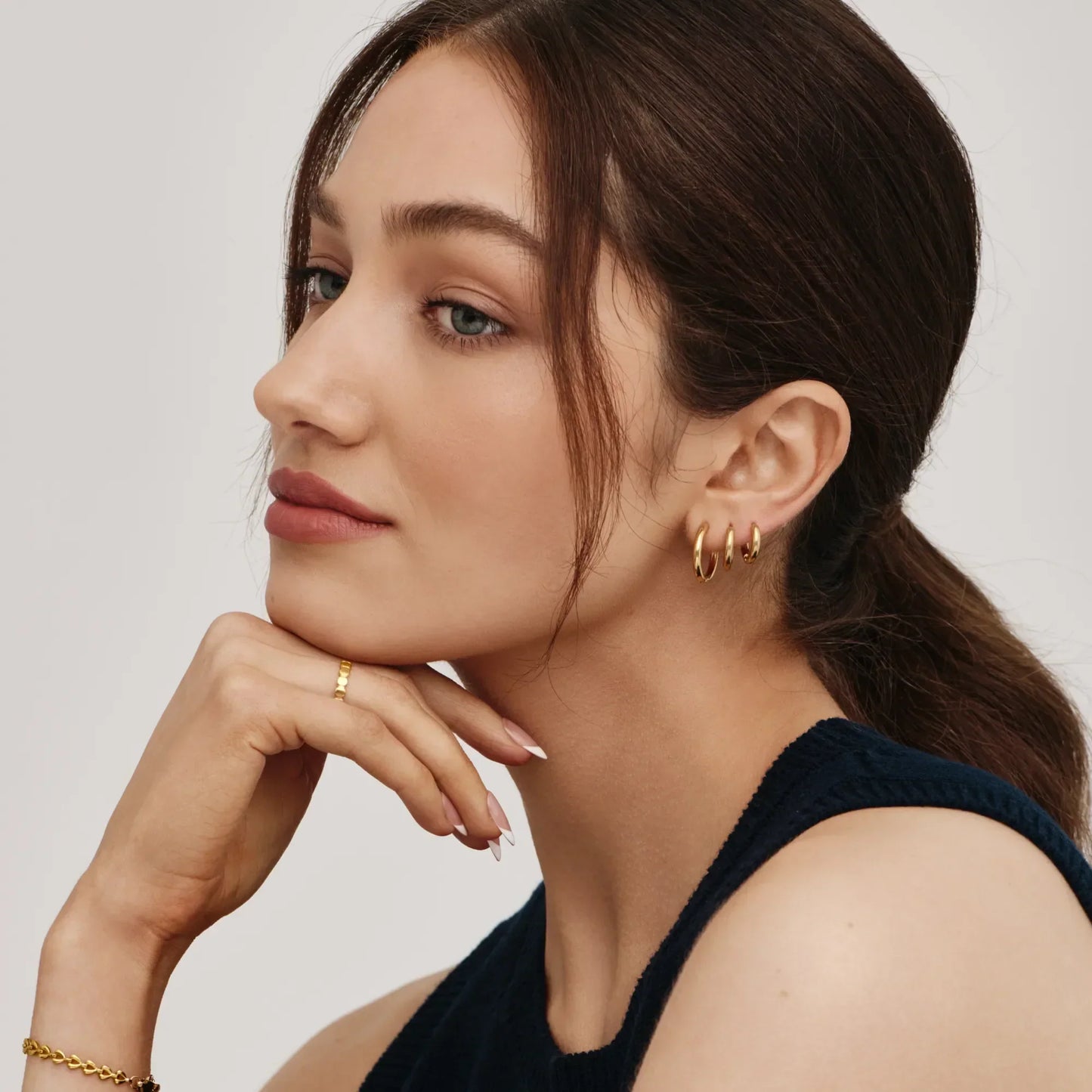 Gold hoop earrings close-up detail — Olivia Jewelry