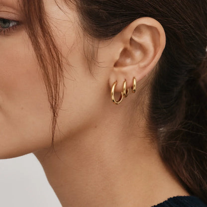 Essential gold hoops lifestyle shot — Olivia Jewelry