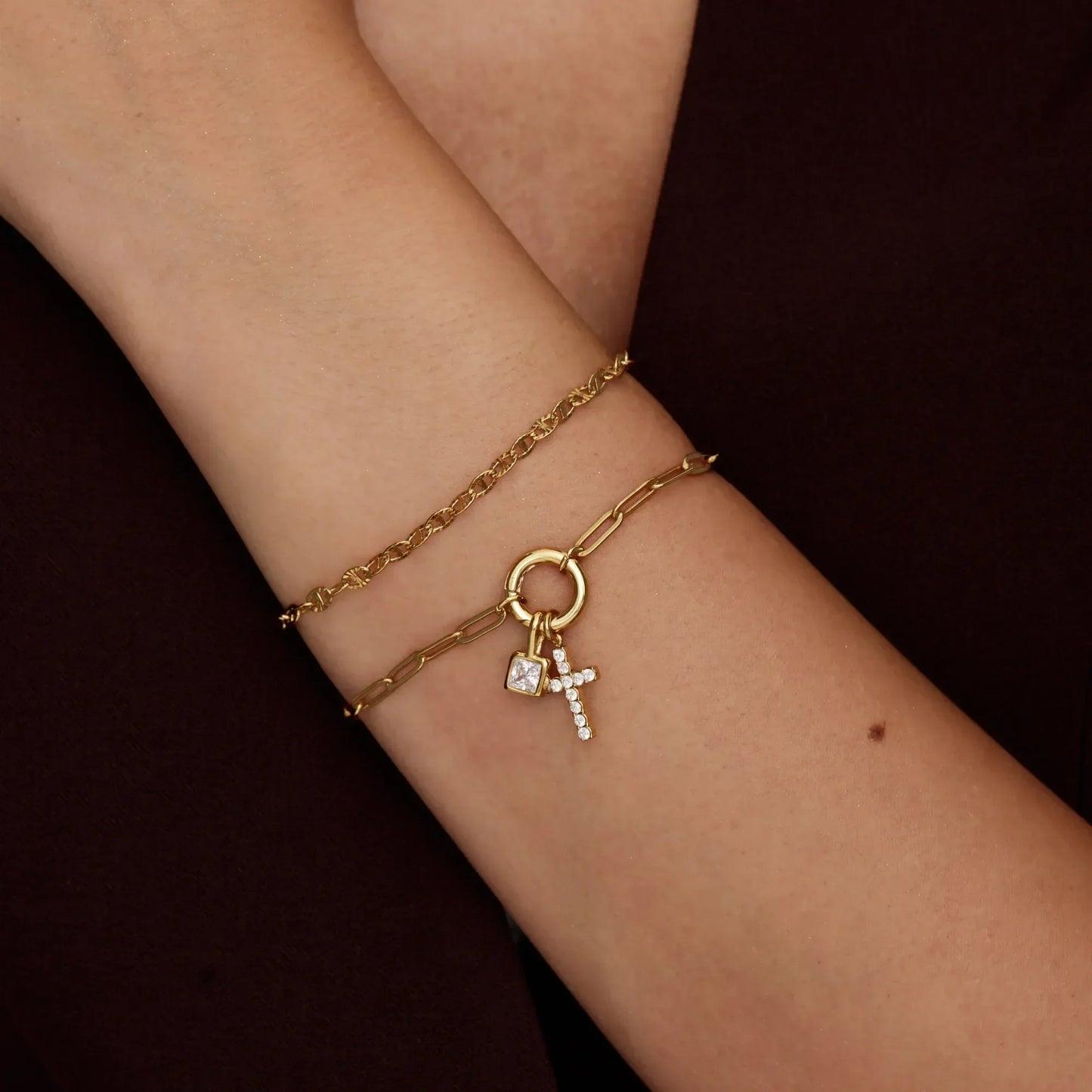 Gold paperclip cross charm bracelet close-up — Olivia Jewelry
