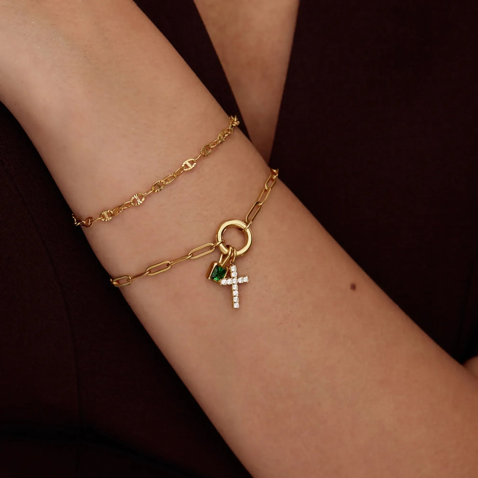 Silver paperclip cross charm bracelet worn on wrist — Olivia Jewelry