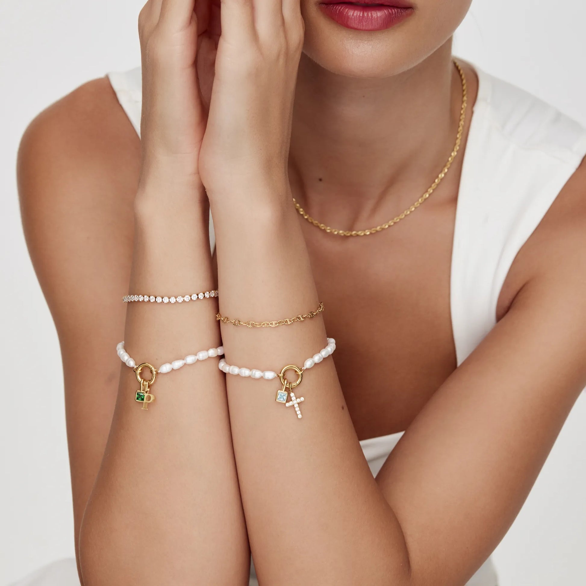 Gold pearl initial birthstone bracelet worn — Olivia Jewelry