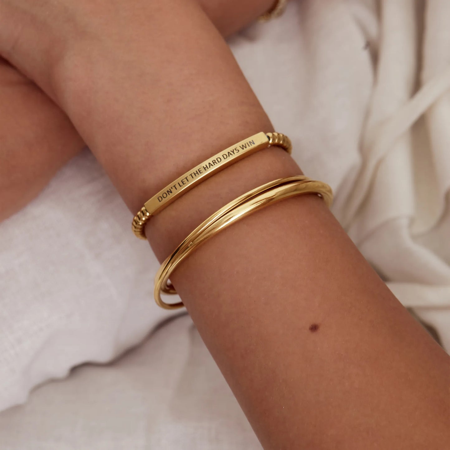 Motivational gold beaded bracelet worn on wrist — Olivia Jewelry