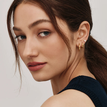 Gold tennis studs close-up detail — Olivia Jewelry