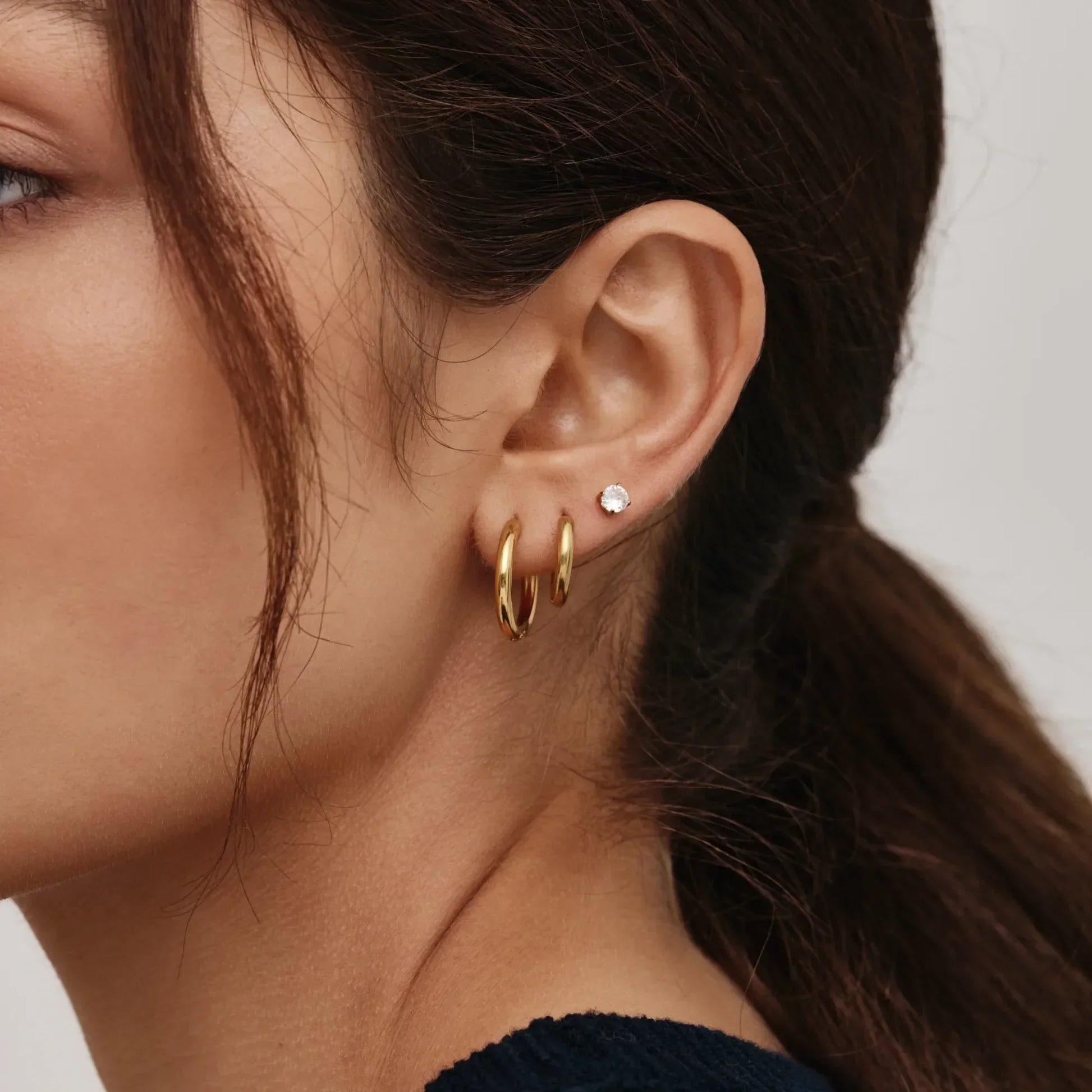 Essential tennis studs flat lay — Olivia Jewelry