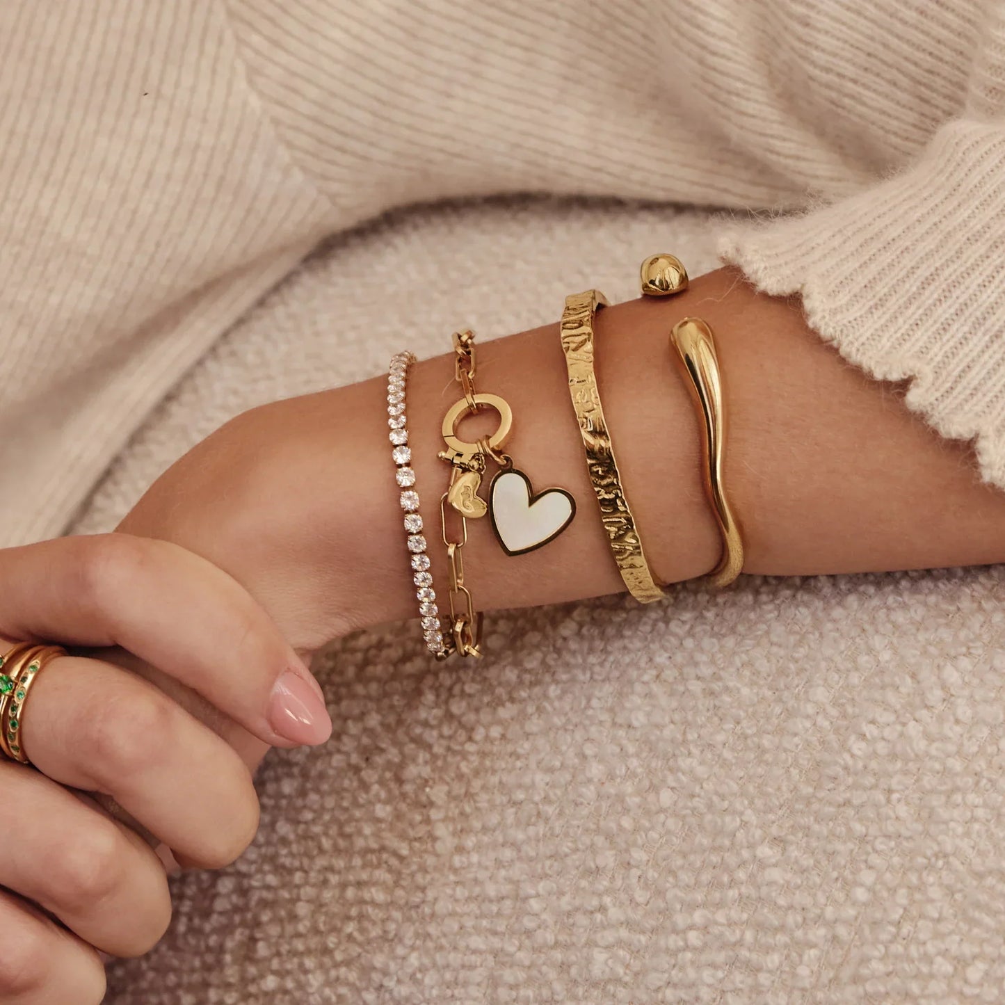 Essential gold textured cuff worn on wrist — Olivia Jewelry