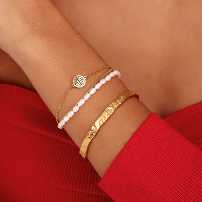 Gold textured cuff bracelet close-up — Olivia Jewelry