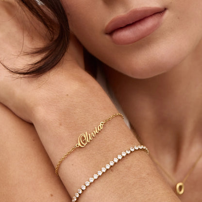 Signature name bracelet flat lay — Olivia Jewelry
