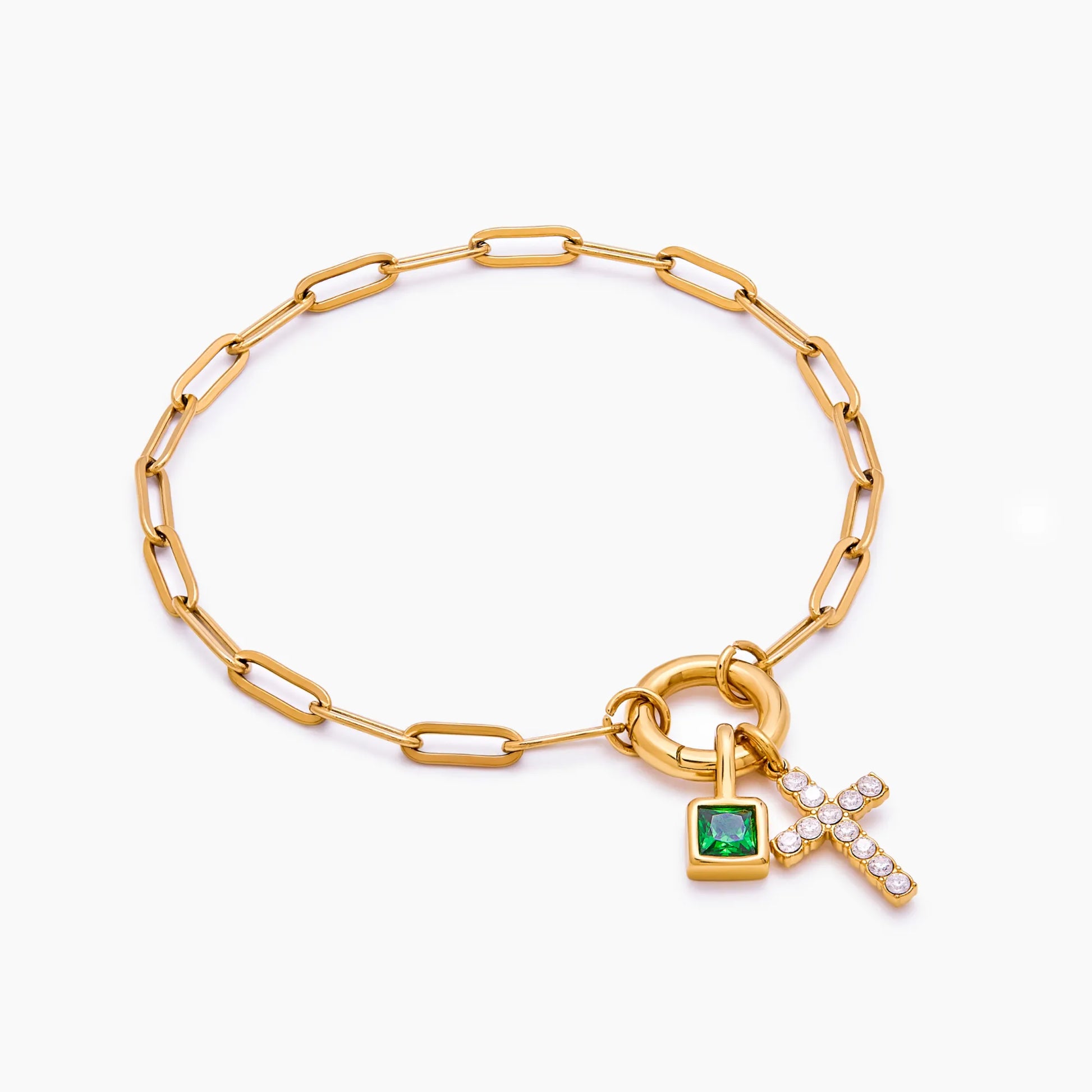 Paperclip cross charm bracelet flat lay — Olivia Jewelry