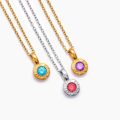 Gold crushed birthstone pendant worn on model — Olivia Jewelry