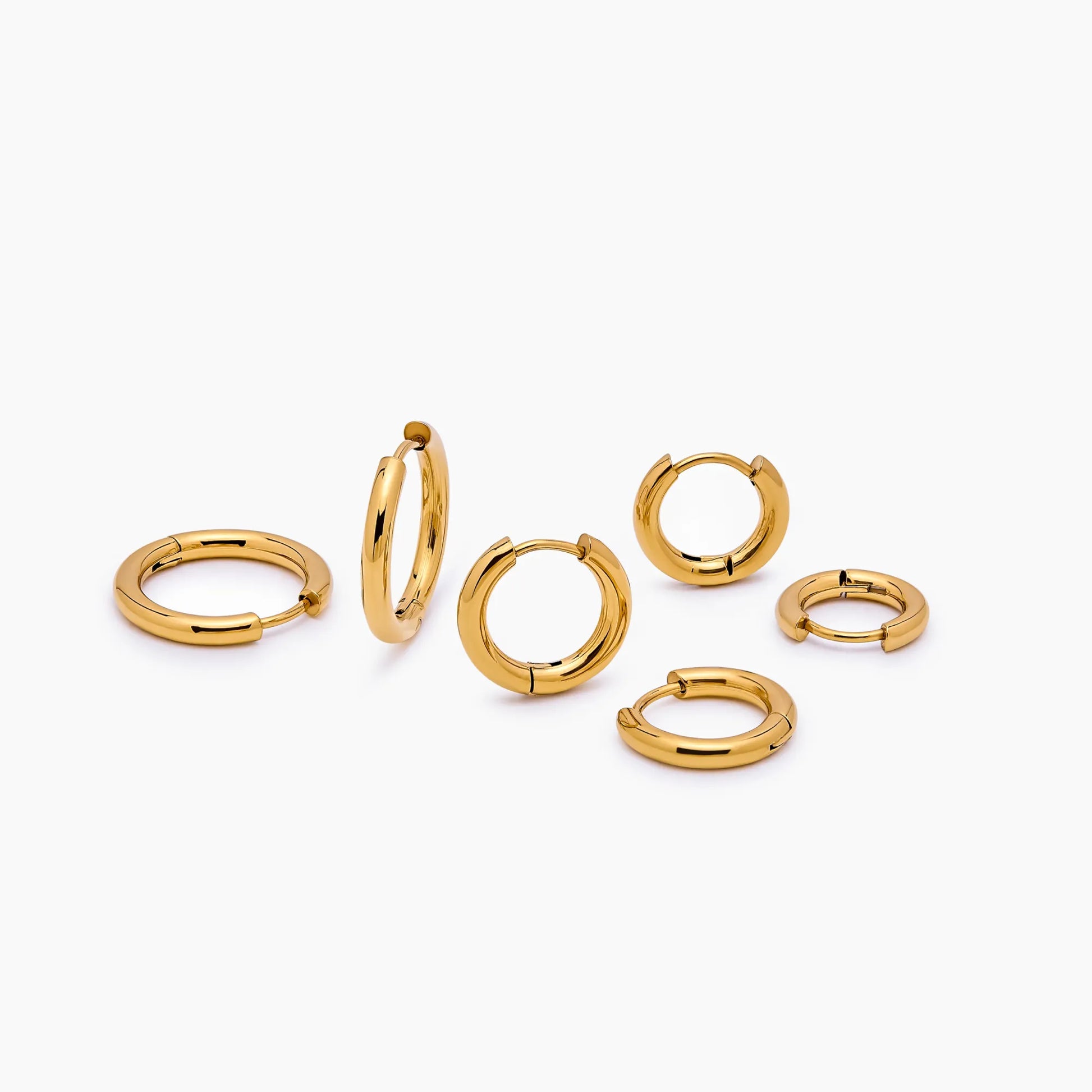 Essential gold hoop set flat lay — Olivia Jewelry