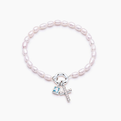 pearl-birthstone-cross-charm-bracelet — Silver / Dec-Blue Topaz