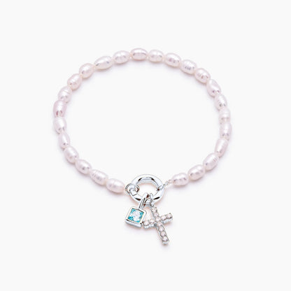 pearl-birthstone-cross-charm-bracelet — Silver / Mar-Aquamarine